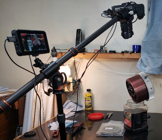 Camera extension arm on tripod